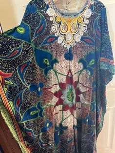 This is a gorgeous homemade kaftan with hand embroidery.  I believe the fabric is a heavy cotton.  Almost like Kente Kloth.  There are no labels or tags.  The kaftan measures 23" across from seam to seam.  I think it is an XL to a 2X.  The colors are so vibrant and the fabric is heavy and beautiful. Embroidered Kaftan, Dress Clothes For Women, Heavy Cotton, Hand Embroidery, Favorite Outfit, Things To Think About, Art Collection, Dress Outfits, Bathing Beauties