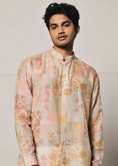 Patchwork print shirt style mal cotton kurta featuring a mandarin collar, cuffed sleeves and a curved hemline. This is a 2 piece set complete with a cream trouser style cotton pajama. Traditional Spring Kurta With Set-in Sleeves, Spring Floral Print Cotton Silk Kurta, Cotton Bandhgala With Printed Motifs For Festive Occasions, Cotton Bandhgala Straight Kurta For Transitional Season, Spring Festive Cotton Bandhgala, Festival Bandhgala With Printed Motifs And Long Sleeves, Festive Cotton Bandhgala With Long Sleeves, Cotton Silk Straight Kurta With Set-in Sleeves, Cotton Silk Kurta With Set-in Sleeves