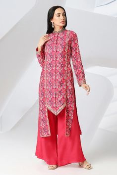 Cherry red full sleeve sherwani style kurta with floral print and gota, sequin embroidery. Paired with palazzo.
Components: 2
Pattern: Printed, Embroidery
Type Of Work: Floral, gota, sequin
Neckline: Mandarin collar
Sleeve Type: Full sleeves
Fabric: Muslin Silk
Color: Red
Other Details: 
Front potli button detailing
Lace embroidered panel
Asymmetric hem
Approx. product weight: 1 kgs
Model height: 5ft 7inches, wearing size S
Occasion: Mehendi and Haldi - Aza Fashions Sherwani Style Kurta For Women, Silk Palazzo Set With Chikankari Embroidery And Long Sleeves, Silk Long Sleeve Palazzo Set With Chikankari Embroidery, Semi-stitched Pink Kurta With Long Sleeves, Semi-stitched Long Sleeve Salwar Kameez, Pink Semi-stitched Long Sleeve Kurta, Bollywood Style Embroidered Long Sleeve Palazzo Set, Red Traditional Wear With Printed Motifs For Navratri, Long Sleeve Semi-stitched Salwar Kameez