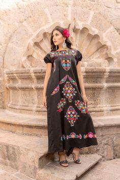 This Beautiful Dress boasts a Traditional Mexican floral design combined with a modern style dress.  The colorful flowers combined with the maxi length make it unique and elegant.  It's made out of fine Mexican cotton, is completely embroidered by hand and has some knit details. This dress is handmade and hand embroidered by Mexican Artisans in Puebla, Mexico. More dresses available here: https://www.etsy.com/es/shop/SoleiEthnic?ref=seller-platform-mcnav&section_id=25367133 Floor-length Embroidered Dress With Multicolor Embroidery, Floor-length Multicolor Embroidered Dress, Traditional Multicolor Maxi Dress With Floral Embroidery, Multicolor Maxi Dress With Floral Embroidery, Multicolor Floral Embroidered Maxi Dress, Multicolor Midi Dress With Floral Embroidery, Embroidered Maxi Dress With Geometric Patterns, Spring Multicolor Embroidered Maxi Dress, Multicolor Embroidered Geometric Maxi Dress