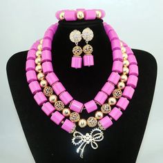 Elevate your Nigerian wedding or party look with this Bead Jewelry. Handcrafted with care, these jewelry pieces add a touch of color and cultural significance to your ensemble, making you stand out with traditional elegance. Traditional Pink Jewelry With Colorful Beads, Traditional Bridal Necklace With Colorful Beads For Party, Multicolor Large Beads For Wedding, Traditional Jewelry Sets With Round Beads For Party, Traditional Pink Jewelry With Polished Beads, Pink Gold Beaded Jewelry For Party, Gold Faceted Beads Jewelry Set For Wedding, Festive Colorful Beaded Necklaces For Wedding, Pink Party Jewelry With Gold Beads