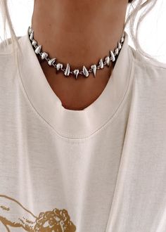 We've been searching for the perfect layering pieces for you to add to your jewelry collection, and we finally found it! This classic necklace set will be your new every day jewelry. Casual enough to wear with a tee on the daily, or dress it up for a night out! Silver in Color Choker Style Necklace Approximately 15.5" in Length Shown Paired with Additional Accessories All Jewelry is Final Sale and is Not Eligible for Return or Exchange Edgy White Jewelry For Gifts, Trendy Everyday Choker With Clavicle Chain, Trendy Everyday Jewelry Choker, Trendy Everyday Clavicle Chain Choker, Trendy Clavicle Chain Choker For Everyday, Trendy Everyday Choker Necklace, Edgy Sterling Silver Jewelry For Everyday, Edgy Everyday Sterling Silver Jewelry, Trendy Everyday Choker Charm Necklace