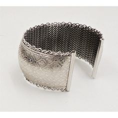 This is part of Chairish’s Costume Jewelry assortment.  1960s rhodium plated fleur de lis cuff bracelet. Marked "Jewels by Julio." Measures:  2 1/4 inches wide by 1 3/16 inches tall by 2 inches deep. Condition: Very good; some minor surface wear towards the back and to the signature. Harder to see in person than in the photos. Rhodium Plated, Cuff Bracelet, Costume Jewelry, Silver Tone, 1960s, Plating, Cuff, Bracelet, How To Wear