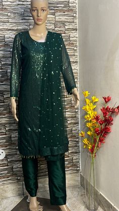 This green sequin straight kurta is made from designer sequin fabric which is eye catching in its look. This is kurta plazzo set .it is paired up with silk plazzo . Both the kurta and pants will have lining inside. We will collect your measurements as soon as the outfit is booked. Please feel free to contact us on etsy convo for further queries. Thank you Bollywood Style Sequined Straight Kurta, Designer Sequined Straight Kurta, Festive Straight Kurta With Sequins, Festive Sequined Straight Kurta, Festive Sequins Straight Kurta, Semi-stitched Sequin Straight Kurta, Semi-stitched Straight Kurta With Sequins, Bollywood Style Straight Kurta With Sequins, Festive Pista Green Anarkali Set With Sequins