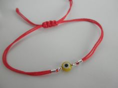 All you need to be protected against the evil eye. This little eyes are about 6mm and the bracelets are adjustable for a perfect fit. This listing is for ONE bracelet, you can choose the eye color and the cord color. eye colors are: blue, red, yellow, green and purple. cord colors are: red, white, gray, black, pink, brown, navy, purple, light blue, green neon, hot pink neon... If you prefer them with a CLASP follow this link: https://www.etsy.com/listing/89266477/evil-eye-bracelet -------------- Adjustable Evil Eye Friendship Bracelet, Adjustable Evil Eye Bracelet For Friendship, Adjustable Evil Eye Friendship Bracelets, Adjustable Evil Eye Bracelet With Sliding Knot, Adjustable Round Evil Eye Bracelet, Casual Adjustable Evil Eye Bracelet As Gift, Adjustable Spiritual Evil Eye Bracelet With Sliding Knot, Casual Evil Eye Friendship Bracelets As Gift, Casual Evil Eye Friendship Bracelets For Gifts