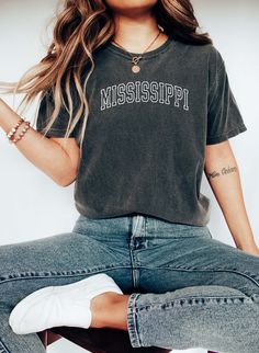 Mississippi Tee, College Style Tee, Mississippi State Souvenir. 100% Cotton, Authentic COMFORT COLORS T-Shirt, Premium Quality Fabric, Printed in the USA Direct on Garment Printing using Water Based Eco-friendly Inks. Unisex Sizing, Relaxed Fit For Women.  Go 1-2 sizes up for the oversized look On White and Ivory colors we print black text. You can compare one of your tees to the sizing chart available in our listing photos. Colors might be look a bit different on different screens, the design i Gray Short Sleeve T-shirt For College, Gray Cotton Top For College, Gray Cotton T-shirt With School Spirit, Casual Gray T-shirt For College, College Style Short Sleeve Screen Print T-shirt, College Style Short Sleeve T-shirt With Screen Print, College Style Cotton Crew Neck Top, Casual Cotton Crew Neck Top, Soft-washed Cotton T-shirt For Fan Apparel