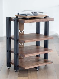 a wooden shelf sitting on top of a hard wood floor