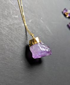 Raw amethyst is a classic in the world of gemstones. It is one of the more affordable stones with the most vibrant natural spectrum of purple tones. I have this necklace in both tiny crystals and large crystals, and a few different chain lengths 💟 **This listing is for only one necklace Each large crystal pendant measures approximately 1 inch in length.💜 Each small amethyst measures between 1/4 and 1/2 inch in length 💜 The chain for ThIs necklace measures 18 inches in length. You can purchase Purple Faceted Amethyst Crystal Necklaces, Faceted Amethyst Healing Necklace, Purple Amethyst Pendant Crystal Necklace, Gold Amethyst Crystal Necklace With Natural Stones, Purple Faceted Amethyst Crystal Necklace, Spiritual Faceted Amethyst Crystal Necklace, Amethyst Pendant For Jewelry Making, Amethyst Stone Necklaces For Gifts, Purple Faceted Crystal Necklaces For Gifts