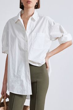 Oversized menswear-inspired shirt with classic collar, button down front, patch pockets at the chest and shirttail hem. Crafted from 100% organic cotton. Classic Collared Shirt In Neutral Color, Oversized Cotton Shirt With Shirttail Hem, Oversized Shirt With Button Closure For Casual Gatherings, Oversized Shirt For Casual Gatherings, Relaxed Cotton Shirt With Pockets, Relaxed Fit Shirt With Buttoned Pockets For Everyday, Everyday Relaxed Fit Shirt With Rolled Sleeves, Relaxed Cotton Everyday Shirt, Relaxed Cotton Shirt For Everyday