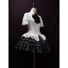 An item that will make you look like a mysterious and elegant young lady. It is richly decorated with lace embroidery and frills, and when paired with a bold chest ornament, it further enhances the gorgeous atmosphere. Like an aristocratic lady from medieval Europe. 
 
 

 

 
 
 
 Item 
 
 Blouse (black) + Jabot (black) 
 Blouse (purple) + jabot (purple) 
 Blouse (white) + Jabot (white) 
 Blouse (white) + Jabot (black) 
 Brooch (black x blue) 
 Brooch ( Black x Red) 
 Brooch ( Black x Purple) Fitted Black Blouse With Doll Collar, Black Doll Collar Blouse For Party, Baroque Victorian Dress With Ruffles For Parties, Fitted Victorian Dress With Ruffles In Baroque Style, Elegant Fitted Baroque Dress, Fitted Short Sleeve Gothic Blouse, Black Gothic Short Sleeve Blouse, Black Victorian Dress With Attached Cancan For Costume, Elegant White Overbust Victorian Dress