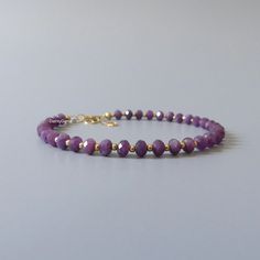 Fall in love with our delicate and rare purple sapphire gemstone beaded bracelet, perfect timeless delicate minimalist design, handmade to be stacked or worn on its own. Will make a thoughtful birthday, Christmas, or anniversary gift for your wife, mother, sister, daughter, or friend. Your purchase will arrive elegantly packed  in a gift-ready suede storage bag  and will include a complimentary cleaning cloth. Treat yourself or your loved ones with this high-quality handmade jewelry gift.  D E T Elegant Purple Beaded Bracelets As Gift, Elegant Purple Beaded Bracelets For Gift, Elegant Purple Beaded Bracelet For Gift, Elegant Purple Beaded Bracelet Gift, Elegant Lavender Beaded Bracelets, Elegant Purple Beaded Bracelets With Tiny Beads, Elegant Amethyst Beaded Bracelets, Elegant Purple Jewelry With Tiny Beads, Elegant Purple Rondelle Beaded Bracelets