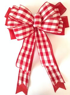 Christmas Tree Topper - Red and White Christmas Decorative Bow - Handmade and Design with Wired Ribbon , Beautiful Gingham Red and White Pattern - Print and has also a Mix Red Ribbon. Tied with wire for easy attachment. Great Christmas Bow for a Christmas Tree , Garland , Wreath , Staircase , Fireplace, Gift Basket , Lamp Post , Gift Wrap, Door Hanger...For sure you will find a perfect spot for this lovely Christmas Bow. The Measurement for this Christmas Bow is : 14 inches wide 15 inches long t Gift Wrap Door, White Tree Topper, Burgundy Christmas Tree, Red And White Tree, Christmas Tree Topper Red, Staircase Fireplace, Basket Lamp, Burgundy Decor, Burgundy Christmas