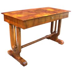 an old wooden table with two legs and a wood slab on the top, against a white background