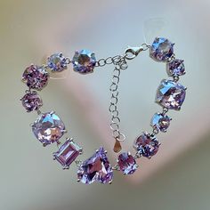 Photos are taken under natural sunlight and from different angles.  NO FILTER, NO FLASH. Suitable for wrist sizes: 12-17 cm. The length of the crystal part is 13 cm. Swarovski crystals.  2 options for the setting material: -925 sterling silver (Less allergenic, durable and tarnish-resistant) -gold plated brass (it will likely tarnish and corrode when exposed to sweat or water.) ------------------------------------------------------------------------------------------ Hey there! Check out my hand Purple Tone, Swarovski Crystal Bracelet, Swarovski Bracelet, Natural Sunlight, Purple Crystals, Crystal Bracelet, Bridesmaid Gift, Chain Link Bracelet, Crystal Bracelets