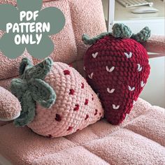 two crocheted strawberries sitting on a chair with the text free pattern only