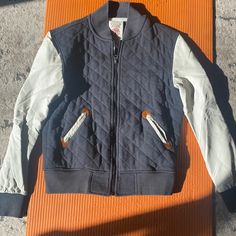 Form The Permanently Closed Who. A. U Brand, This Men’s Jacket Is Perfect For Fall Weather. With A Quilted Black Cotton Patterns In Front With Faux Leather Sleeves. Sleeves Are In Great Condition With No Cracking. Zipper Up. Some Brown At The Sleeve And Pocket Outlines. 2 Pockets In Front Winter Outdoor Varsity Jacket With Patchwork, Sporty Quilted Outerwear For Streetwear, White Sporty Quilted Outerwear, Sporty White Quilted Outerwear, Sporty Varsity Jacket For Streetwear, Urban Varsity Jacket With Pockets For Outdoor, Casual Sports Outerwear With Patchwork, Fall Sports Cotton Outerwear, Sporty Varsity Jacket With Pockets For Fall