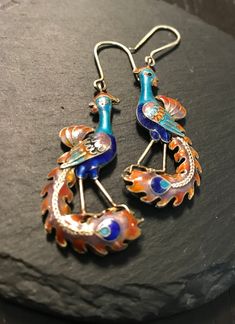 "A vintage pair of silver clousione enamel PEACOCK drop dangling pierced earrings.  Condition I see no problems.  The length with silver hook wires is approx 2 1/2\".  Amazing hand fired meticulously enameled front and back sides-fine quality and design to the jewels of the bird family.  I raised Peacocks -they are amazingly beautiful and full of personality-a joy to behold!." Gift Silver Earrings With Peacock Design, Silver Peacock Design Earrings Gift, Silver Earrings With Peacock Design As A Gift, Formal Peacock Design Drop Earrings, Silver Peacock Design Earrings As Gift, Pierced Dangle Earrings In Enamel, Elegant Silver Enamel Earrings, Artistic Enamel Drop Earrings, Artistic Enamel Jewelry With Earrings