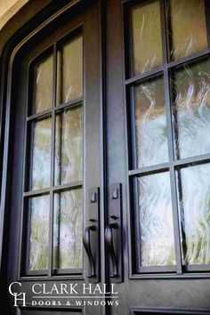 the front door to a house with glass windows