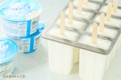 ice cream popsicles are lined up on a tray and ready to be dipped with toothpaste