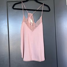 Lacey Neckline Camisole Mauve Pink Never Worn, Tags Attached Feminine Tank Top With Built-in Bra, Chic Sleeveless Lace Top With Built-in Bra, Spring Sleeveless Tank Top With Delicate Straps, Spring Sleeveless Camisole With Delicate Straps, Sleeveless Camisole With Delicate Straps For Spring, Spring Lace Cami Top With Built-in Bra, Delicate Straps Sleeveless Camisole For Spring, Feminine Tank Camisole For Daywear, Summer Lace Top Camisole For Loungewear