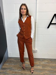 Product: 3 Piece - Jacket, waistcoat and trousers (Pants). Colour: Burnt Orange Product Status: Pre Order Promo Starting with the jacket, it has 2 workable pockets in the front and also a working chest pocket at the front. The closure is a two button closure and the back is double vented. The jacket also has an inside pen pocket and the inside lining is plain black. Moving on to the waistcoat, it consists of two working front pockets, and the closure is a 4 button closure. The back has an adjust Burnt Orange Work Outfit, Orange Formal Outfit, Burnt Orange Blazer Outfit, Gay Prom, Green Suit Women, Orange Blazer Outfits, Orange Blazer, Orange Suit, Formal Pants