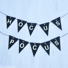 a black and white banner with the word hoccus on it