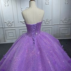 Make a dazzling entrance in this Quinceanera Dress that combines sparkling glamour with timeless elegance. This A-line gown is crafted from luxurious purple sequin fabric and features a sweetheart neckline that flatters the bust and creates a graceful, feminine silhouette. The intricate applique detailing and shimmering sequins embellish the bodice, adding a touch of sparkle and sophistication that will catch the light from every angle. The sweep train adds a romantic flow to the design, creatin Sequin Fitted Quinceanera Dress For Debutante Ball, Fitted Sequin Quinceanera Dress, Fitted Sequin Gown For Quinceanera, Quinceanera Gown With Sequins And Fitted Bodice, Fitted Sequined Ball Gown Quinceanera Dress, Glamorous Sequined Ball Gown Quinceanera Dress, Fitted Sequined Quinceanera Ball Gown, Glamorous Sequined Quinceanera Ball Gown, Fitted Ball Gown Quinceanera Dress With Sequins