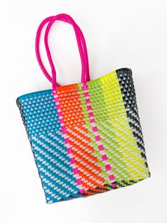 Introducing the Kathryn Weaved Tote! This Small tote is the perfect statement piece with its vibrant Black and multicolors and unique basket weave design. Featuring long straps, it's not only stylish but also practical. Upgrade your fashion game with this must-have accessory. Small Tote, Basket Weave, Basket Weaving, Fashion Games, Statement Pieces, Weaving, Black, Design