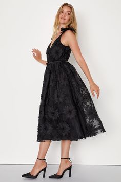 If you're looking for a dress that will always impress, you need the Lulus Definition of Drama Black Floral Applique Tie-Strap Midi Dress! Stretchy, lightweight mesh fabric (with subtle Swiss dots) features an applique ribbon design that shapes tonal flowers of varying sizes. Tying shoulder straps support a darted surplice bodice with a V-back and a satin ribbon detail at the fitted waist. Skirt boasts a classic A-line silhouette with a hidden layer of tulle for volume. Hidden zipper/clasp at ba Mesh Dress With Spaghetti Straps For Summer Evening, Summer Evening Mesh Dress With Spaghetti Straps, Black V-neck Mesh Dress For Summer, Elegant Spring Mesh Dress With Spaghetti Straps, Elegant Mesh Dress With Spaghetti Straps For Spring, Elegant Summer Mesh Dress With Spaghetti Straps, Elegant Spaghetti Strap Mesh Dress For Summer, Elegant Mesh Dress With Spaghetti Straps For Summer, Sheer Midi Dress For Prom In Spring