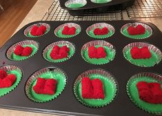 cupcake tins with red and green frosting in the shape of heart shapes