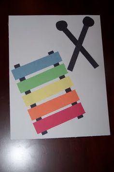 a piece of paper that has scissors and tape on it with the letter x cut out