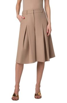 Front pleats release to flare the legs and bring swing to the silhouette of these knee-length culottes unexpectedly tailored from wool flannel. Zip fly with hook-and-bar closure Front zip-slant pockets; back welt pockets 100% virgin wool Dry clean Made in Romania Designer Clothing Elegant Short Culottes For Spring, Elegant Short Length Culottes For Spring, Chic Office Bottoms With Box Pleat, Elegant Short-length Spring Culottes, Chic Knee-length Bottoms With Pleated Waist, Elegant Wool Pleated Bottoms, Elegant Pleated Wool Bottoms, Pleated Knee-length Bottoms For Work, Knee-length Pleated Bottoms For Work