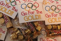 several pieces of candy with gold and silver foil on them, all labeled go for the gold