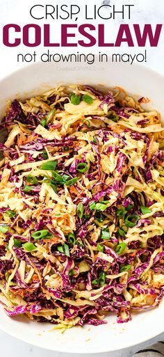 a white bowl filled with coleslaw on top of a table