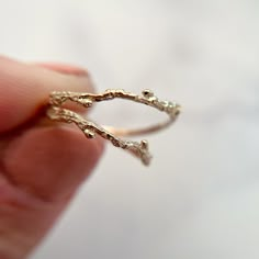 "This nature inspired piece is delicately handcrafted by a skilled artisan. This twig ring is carefully crafted to reflect the organic beauty of nature. 100% recycled gold  Every single ring in my collection is designed, sculpted and produced entirely by hand. I never use computers and I never use \"off-the-shelf\" designs that you see in so many jewelry stores. Each ring begins by casting an actual twig or piece of bark; its natural, imperfectly beautiful texture is imprinted in the gold. This Delicate Hand Forged Wedding Rings, Dainty Hand Forged Wedding Jewelry, Delicate Hand Forged Jewelry For Wedding, Nature-inspired 14k Gold Wedding Jewelry, Nature-inspired Open Ring Wedding Jewelry, Nature-inspired Recycled Gold Wedding Jewelry, Nature-inspired Recycled Gold Wedding Ring, Branch Wedding Ring, Tree Branch Wedding