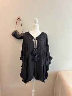 Vintage Black Free People Bohemian Poncho Pre-owned in great condition Size: S 100% cotton Brand: Free People Comfortable, cozy, cool. Lightweight in a deep black color with cute little tassel details. Oversized Black Summer Poncho, Black Poncho For Summer, Black Long Sleeve Poncho For Beach, Black Long Sleeve Beach Poncho, Oversized Black Bohemian Cover-up, Black Beach Poncho One Size, Black Bohemian Poncho For Summer, Black One Size Poncho For Beach, Bohemian Black Summer Poncho