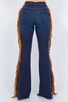 Look like you rodeoed your way to wardrobe perfection in these fringe bell bottoms! Made with a premium soft stretch denim for a great fit and dark blue for badass vibes, these 34" inseam jeans have sides fringe detail and functional pockets front and back. Saddle up for style.This garment is MADE TO ORDER and is Final Sale. Style: high rise Silhouette: bell bottom Embellishment: fringe tassels Length: full length Closure: zipper, button Made In: USAFabric Contents: 52% RAYON26% COTTON21% POLYES Fitted Flares With Frayed Hem For Fall, Fall Denim Blue Flare Jeans With Frayed Hem, Fall Flare Jeans With Frayed Hem In Denim Blue, Dark Wash Flares With Frayed Hem For Fall, Denim Bottoms For Fall Festivals, Wide Leg Jeans For Fall Festival, Wide-leg Jeans For Fall Festival, Bohemian Medium Wash Flare Jeans For Fall, Bohemian Flare Jeans In Medium Wash For Fall