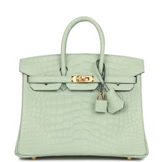 This Birkin is in Vert D'Eau matte Mississippienis alligator leather with gold hardware and has tonal stitching, front strap, two straps with center toggle closure, clochette with lock and two keys and double rolled handles. The interior is lined with Vert D'Eau chevre and has one zip pocket with an Hermes engraved zipper pull and an open pocket on the opposite side. Payment for this item is by Bank Wire only unless other arrangements have been made. Collection: UOrigin: FranceCondition: Pristine; new or never (Plastic on hardware)Accompanied by: Hermes box, Hermes dustbag, clochette, lock, two keys, clochette dustbag, rainhat, care booklet, CITES and feltMeasurements: 10" width x 7.5" height x 4.75" depth; 2.75" handle drop Luxary Handbags, Hermes Bags Birkin, Classy Handbags, Birkin Bags, Hermes Birkin Handbags, Lady Bags, Hermes Birkin 25, Hermes Box, Birkin 25