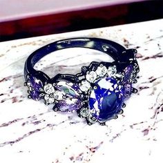 Exclusively Fancy | Jewelry | Womens Ring Black And Purple Ring Nwt Sizes 69 With Ring Box Nwt | Poshmark Purple Gemstone Rings For Party, Elegant Black Amethyst Promise Ring, Purple Gemstone Party Rings, Purple Oval Rings For Party, Purple Oval Party Rings, Elegant Black Amethyst Ring, Black And Purple Ring, Purple Ring, Purple Rings