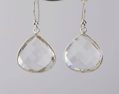 A pair of large natural quartz set in sterling silver bezel:1. Stone : clear quartz (natural gemstone)2. Stone size: (22 x 20 mm)3. earring total length ~36 mm4. bezel material: gold plated5. earring hook: gold plated6. if sending as a gift, a personalized jewelry note card can be includedEarrings in other colors are available. Please browse my other earring listings or send you inquiry. Emerald Earrings Drop, Bezel Set Earrings, Pear Earrings, Natural Stone Earrings, Jewelry Card, Big Earrings, Emerald Earrings, Quartz Earrings, Large Earrings