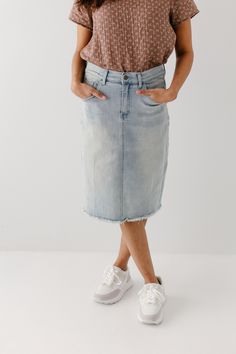 Light wash denim is a must have for any spring/summer wardrobe! Made from a soft and stretchy denim, this raw hem denim skirt is on trend! The knee length 'Lily' brings all the style and still keeps it classy with a flattering, modest fit! 97% Cotton/3% Spandex Wash Cold Gentle Cycle Hang to Dry Light Distressing Soft, Stretchy Denim Model Height 5'5" | Wearing Size 4 Wearing 'Maria' Floral Cotton Top & 'Lily' Light Denim Knee Length Skirt Please carefully measure a similar item before placing y Spring Knee-length Denim Blue Skirt, Trendy Mid-rise Denim Skirt With Frayed Hem, Spring Mid-rise Washed Denim Skirt, Spring Mid-rise Stretch Denim Skirt, Summer Stretch Denim Skirt, High Rise Bottoms With Unfinished Hem For Spring, Spring High-rise Dark Wash Denim Skirt, Casual Medium Wash Denim Skirt For Spring, Spring High Rise Stretch Denim Skirt