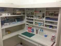 a pharmacy room with shelves full of medicine and supplies