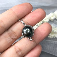 Cute and chic genuine Tahitian cultured pearl pendant necklace, pearl sized 11-12mm in peacock tone and mirror sheen, set in sterling silver globe bail, accent by silver made stars and moon, the accents are all pined in won't fall out, it's a healing piece by collecting the energy from planet and space, as perfect gift for Anniversary, Birthday, Engagement, Wedding, Mother's day, Valentine's day or just a reward for yourself. Quality: AA+ Color: Peacock tone Luster: Mirror sheen Nacre: Lustrous Tahitian Pearl Necklace With Pearl Pendant For Anniversary, Tahitian Pearl Pendant Jewelry, Tahitian Pearl Pendant Necklace, High Luster Tahitian Pearl Necklace As Gift, Tahitian Pearl Necklaces For Anniversary, Tahitian Pearl Pendant Jewelry As Gift, Tahitian Pearl Round Pendant Necklace For Anniversary, Tahitian Pearl Pendant Necklace As Gift, Gift Tahitian Pearl Necklace With High Luster