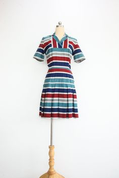 1960s Vintage Cotton Mini Shift Collared Dress with Pleated Skirt M e s u r e m e n t s;    Bust * 43cm / 17"  Waist * 33cm / 13"  Hips *  45cm / 18"   Length * 81cm / 32" Sleeve * 9cm / 3.5" Shoulders * 38cm / 15"  F e a t u r e s; ⁍ medium weight cotton 100% with woven stripe pattern ⁍ fly zipped side closure   ⁍ unlined S p e c i f i c s; label/tag - n/a approx. fit - XS condition - excellent vintage condition flaws found - none  *Measurements are taken along one side of garment lying flat ; Bust = from underarm seam to seam, Sleeve = from underarm seam to end, Waist = narrowest part of skirt from seam to seam, Hips = widest part of skirt from seam to seam, Length = from shoulder hem next to collar to bottom hem, Shoulders = straight line from one shoulder seam to the other ** The best Mod Shift Dress, Twiggy Dress, Scooter Dress, Vintage 60s Dress, Vintage Dress 60s, Striped Dress Summer, Dress Pleated, 60s Dress, Mod Dress