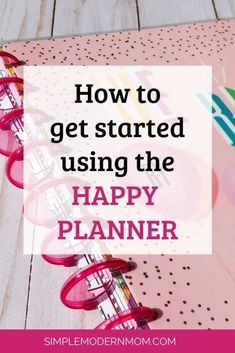 a pink planner with the words how to get started using the happy planner