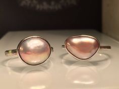 "Modern Pearl Ring. Unique Pearl Ring. Blush Pearl Ring. Solitare Pearl Ring. Trillion Pearl Ring. Pink Pearl Ring. Modern Pearl Ring. Beautifully Handcrafted upcycled bezel set Natural Cultured Pearl set on a lightly hammered solid sterling silver band.. This unique yet very versatile ring is a size 9 1/2 but is available in any size with a very similar Pearl and is sure to be your go to accessory and is perfect for wearing on any finger. . ❤️❤️Give the thoughtful gift of handcrafted. ❤️❤️ Grea Pink Teardrop Fine Jewelry Ring, Handmade Pink Rings For Anniversary, Handmade Pink Toe Ring Jewelry, Handmade Pink Toe Ring, Pink Pearl Ring For Wedding, Pink Moonstone Sterling Silver Ring For Anniversary, Pink Teardrop Anniversary Ring, Pink Oval Stackable Jewelry, Handmade Pink Ring In Fine Jewelry Style