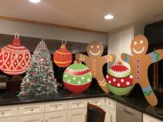 christmas decorations are displayed on the kitchen counter