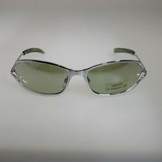 Unisex Fashion Sunglasses Light Green Mirror Lenses Chrome Silver Rim Innovative Design With Open Side Rim Has Spring Hinges For Comfortable Wear Uv Protection 400 No Case Dare To Look Different! Mod 14490 C2 Temple Length 5 3/8 In Front Measurement 5 1/2 In Size 60-15-135 Silver Metal Sunglasses With Tinted Lenses, Silver Sunglasses With Uva Protection For Summer, Formal Silver Sunglasses With Tinted Lenses, Silver Tinted Sunglasses For Formal Occasions, Silver Tinted Sunglasses For Formal Events, Classic Silver Sunglasses With Uva Protection, Modern Silver Sunglasses With Uva Protection, Classic Silver Glass Sunglasses, Silver Polarized Sunglasses For Outdoor