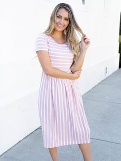 Looking for a dress that's both stylish and comfortable? Look no further than our Striped Midi Dress! With its classic stripes and midi-length, this dress is perfect for any occasion. Whether you're running errands or going out for a night on the town, this dress has got you covered. Pair it with a jean jacket and sneakers for a casual look, or dress it up with some great jewelry and heels for a more formal affair. Size: Small 0-4 Medium 6-8 Large 10-12 XL 12-14 Striped Dresses, Church Clothes, Maxi Skirt Dress, Breezy Dress, Striped Midi Dress, Pink Midi Dress, Night On The Town, Outfit Look, Knee Length Dresses