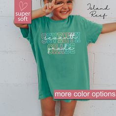 - This Is A Premium Youth Comfort Colors® Shirt - 8/7/24 PLEASE READ INFORMATION BELOW:  Get your kids ready for the first day of school with our Comfort Colors® Seventh Grade Kids Shirt, perfect for any 7th grader! This 7th Grade Youth Shirt is an ideal gift for elementary school students, offering comfort and style as a top choice for back to school tees.  Our Seventh Grade TShirt is designed for both boys and girls, making it a great gift for 7th grade kids. Shop now for the best Seventh Grad Green School Spirit Tops For School, Green Pre-shrunk Shirt For School, Green Pre-shrunk Tops For School, Green Text Print T-shirt For School, Green Short Sleeve School Shirt, Green Short Sleeve Shirt For School, Green Relaxed Fit Top With Name Print, Green School Spirit Top, Green School Tops With Text Print